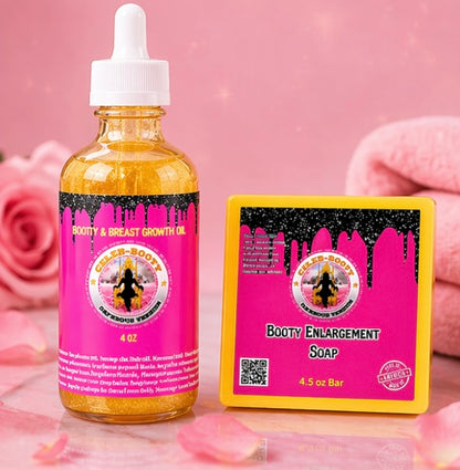 Bottle of 'Booty & Breast Growth Oil' and soap bar on a pink background with roses.