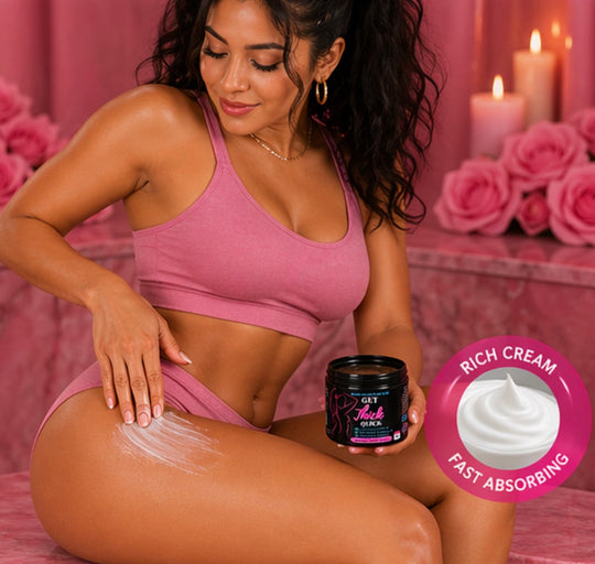 Woman applying cream to her leg with a product container, surrounded by pink roses and candles.