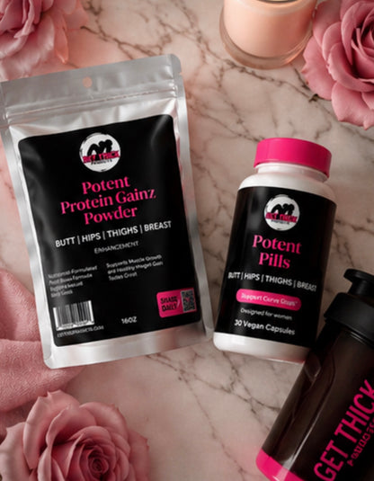 Protein powder and supplement bottles with branding on a marble surface with pink roses.